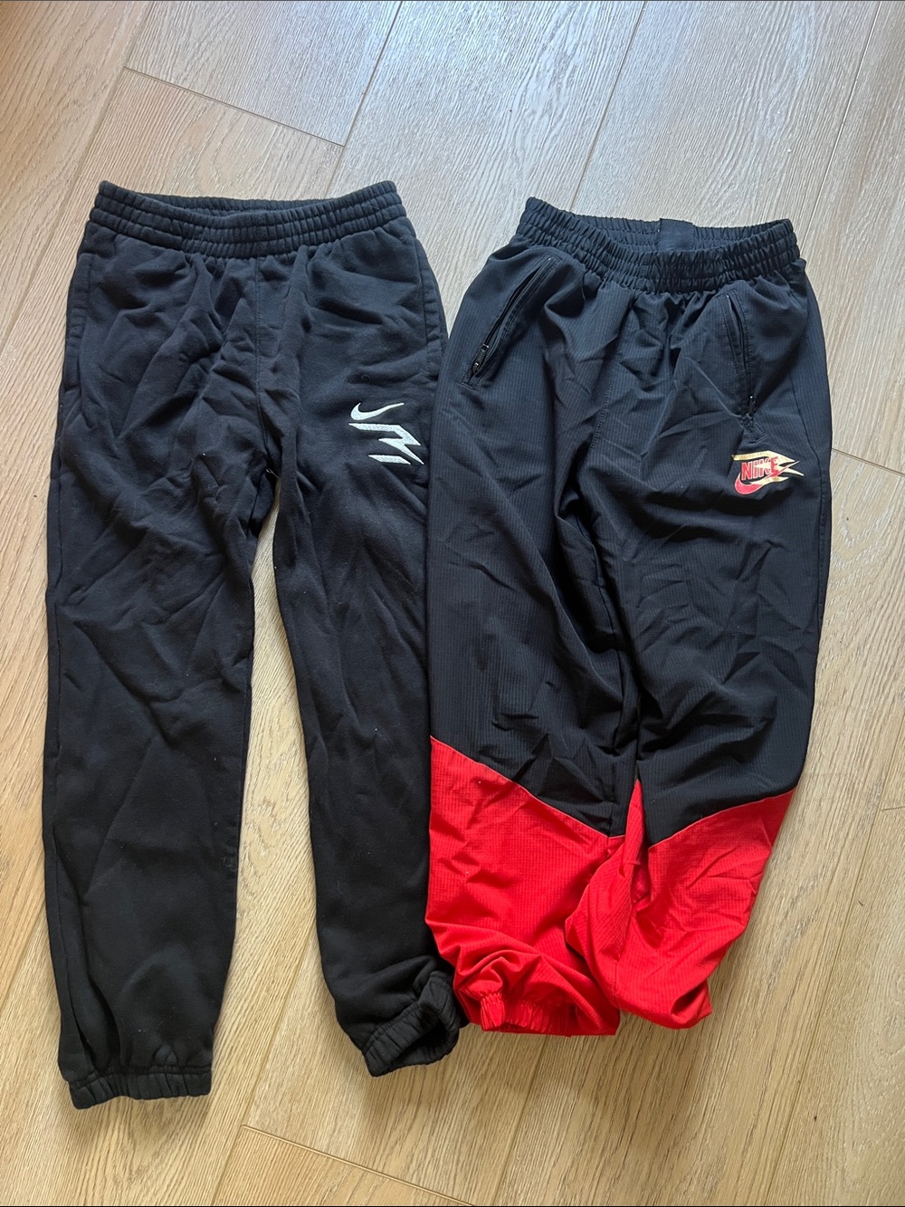 Nike Kids Black Joggers with Red Panel Detail